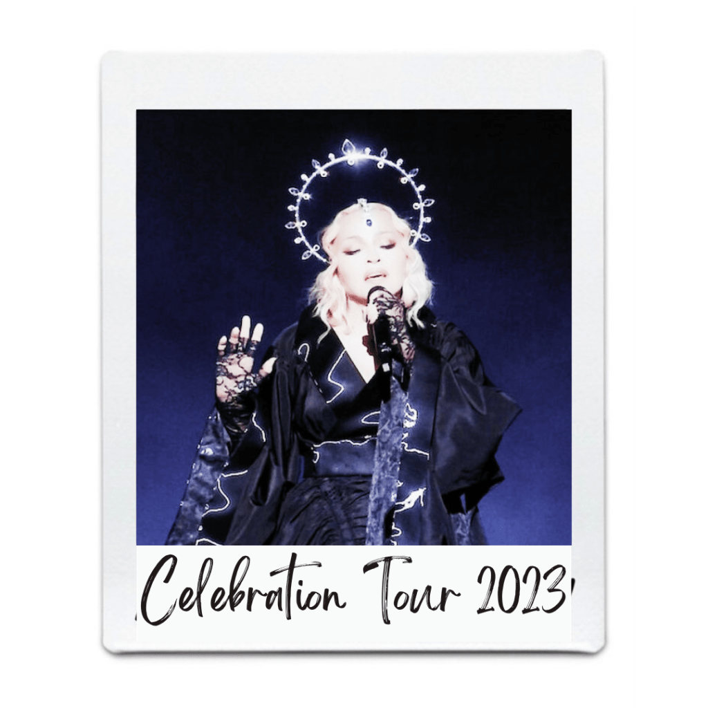 A performer wearing a black outfit and gloves, singing into a microphone on stage, with a glowing halo effect above their head, promoting the 'Celebration Tour 2023'.