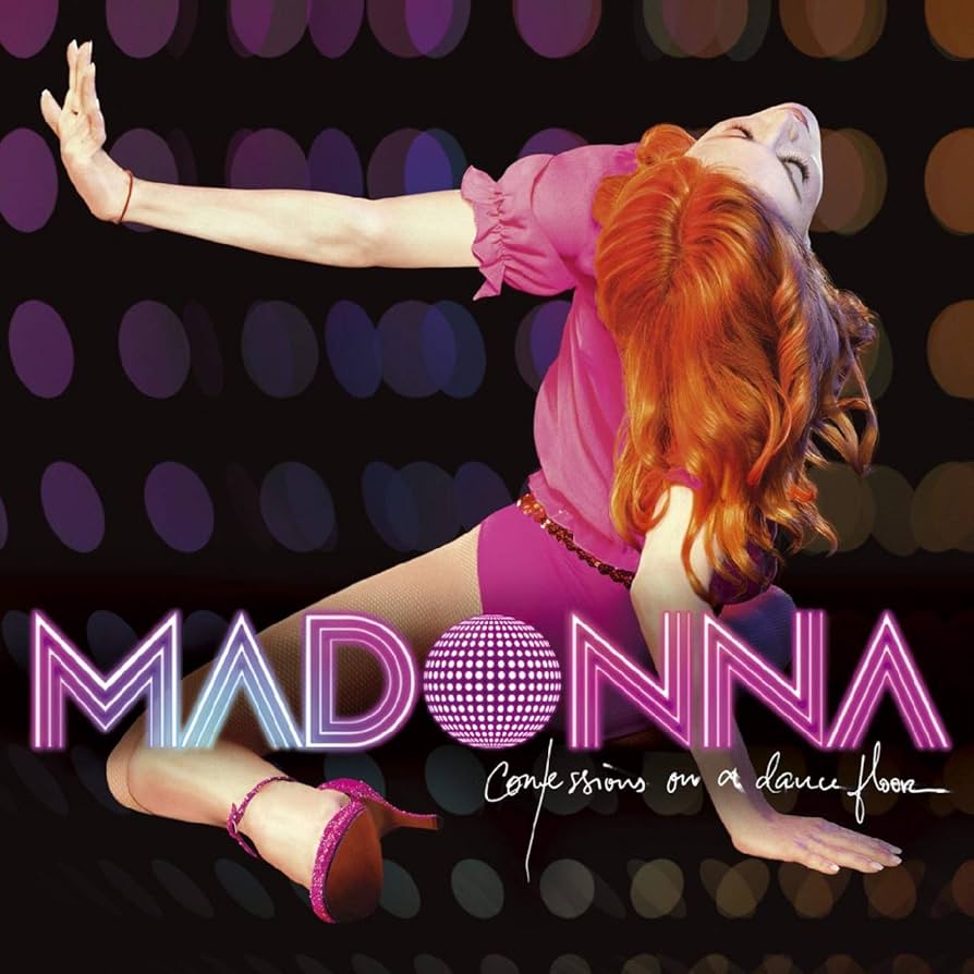 A stylized image of a female dancer with vibrant red hair, wearing a pink shirt and shorts, performing an expressive pose against a colorful bokeh background. The text 'MADONNA' and 'Confessions on a dance floor' is prominently displayed.