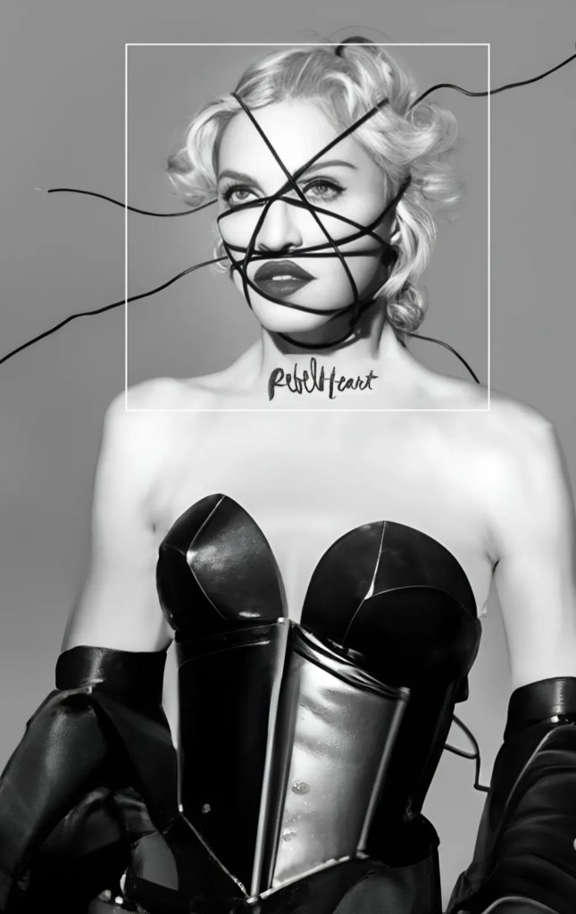 A black and white portrait of a woman with a stylish bob haircut, wearing an edgy black outfit. She appears to be wrapped in thin cords, and the words 'Rebel Heart' are visible below her chin.