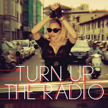 A woman with blonde hair and sunglasses dancing on a city street, with the text 'TURN UP THE RADIO' overlaying the image.
