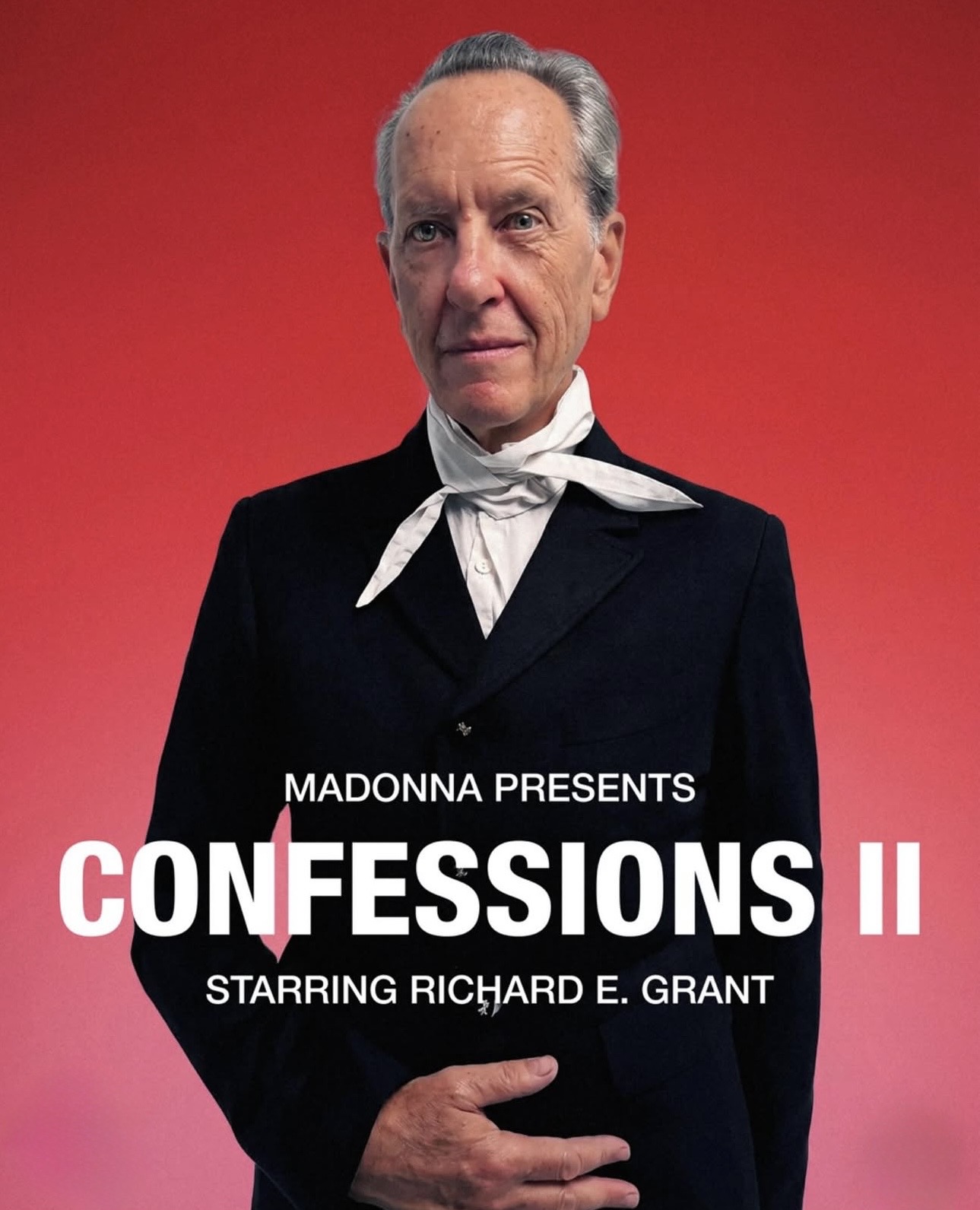 Promotional image for 'Confessions II' featuring a man in a black suit with a white scarf, set against a bright red background.