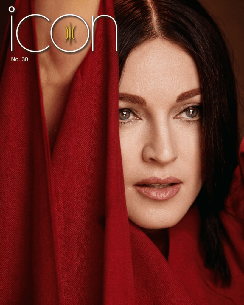 Close-up of a woman's face partially draped in a red fabric, with her hair styled down and a neutral makeup look. The image includes the word 'icon' and the issue number 'No. 30' at the top.
